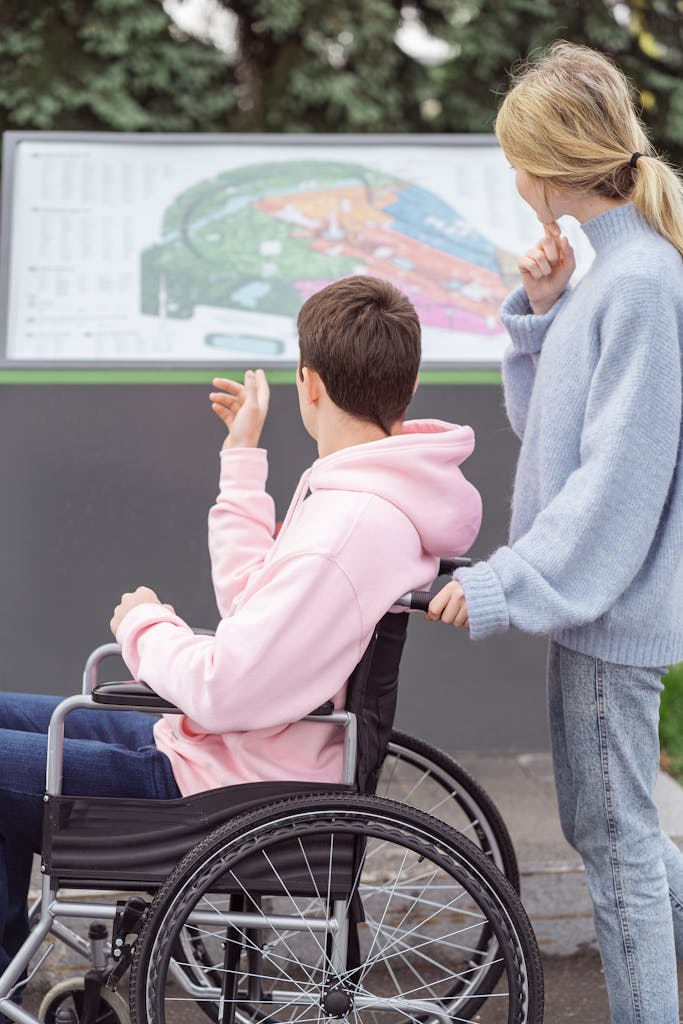 A couple exploring outdoors with a wheelchair and a map, fostering inclusivity and adventure.